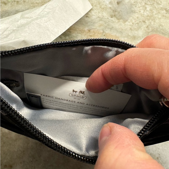 NWT!! Coach wristlet, still in packaging!! Black, silver, and grey. Smoke free - Picture 6 of 9